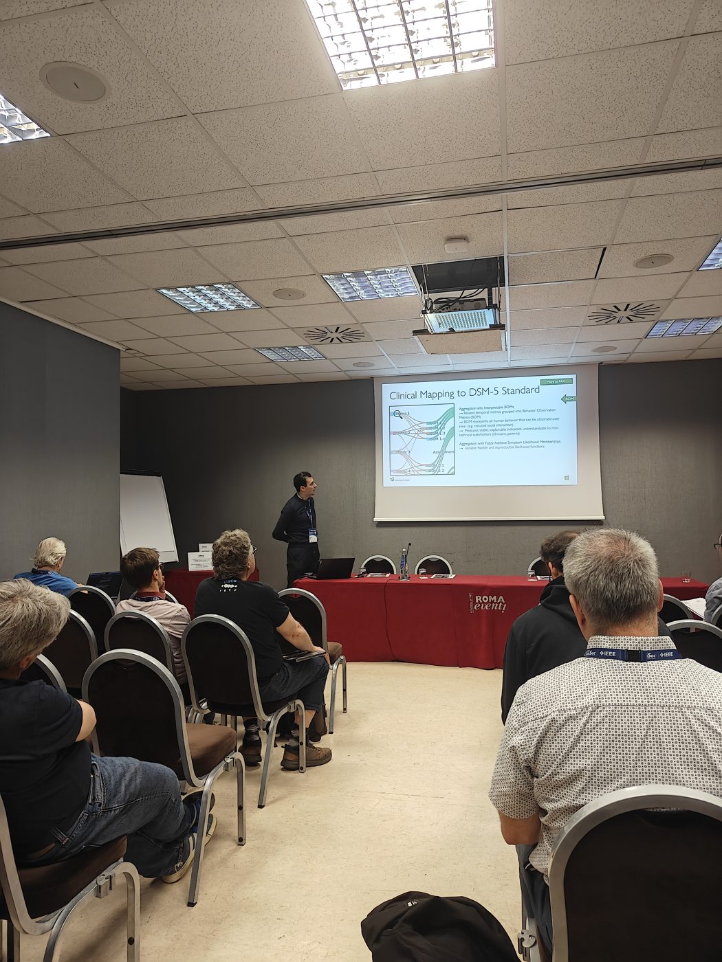 Stephan Nef presenting CareNet at NOMS 2026