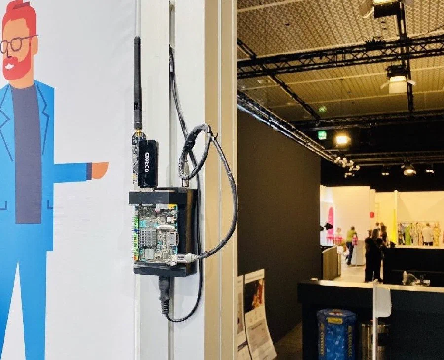 PasWITS project photo: A wireless sensing node, and the system shown at a partner event.