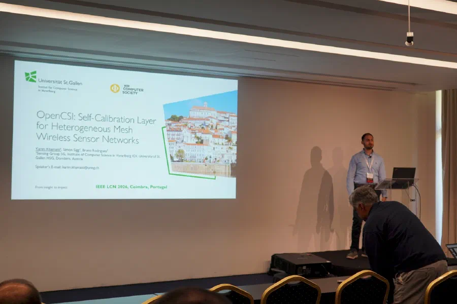 Presenting the paper at IEEE LCN 2026 in Coimbra (photo: IEEE LCN 2026).