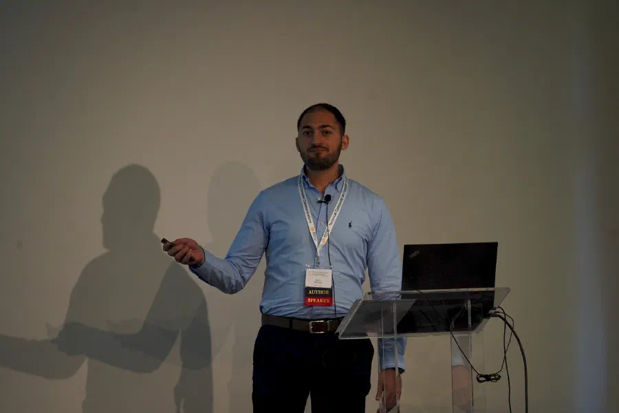 Karim Khamaisi presenting the self-calibration layer (photo: IEEE LCN 2026).