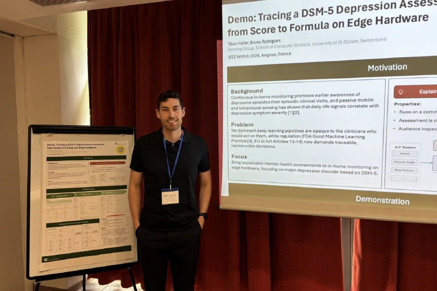 Tibor Haller with the demo poster at IEEE WiMob 2026 in Avignon.